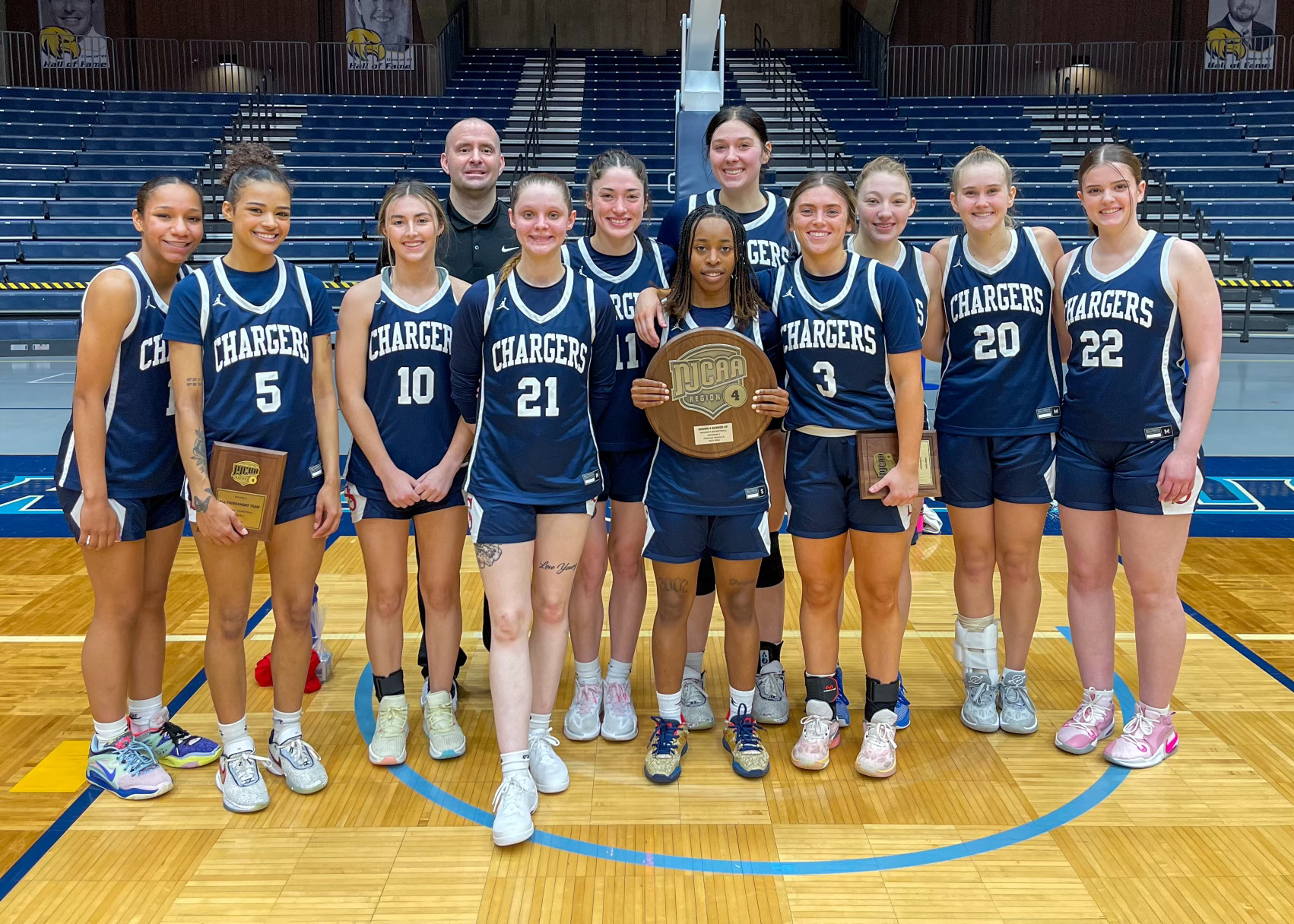 The Sandburg women's basketball team with its runner-up plaque following the Region 4 championship game Saturday against Morton.