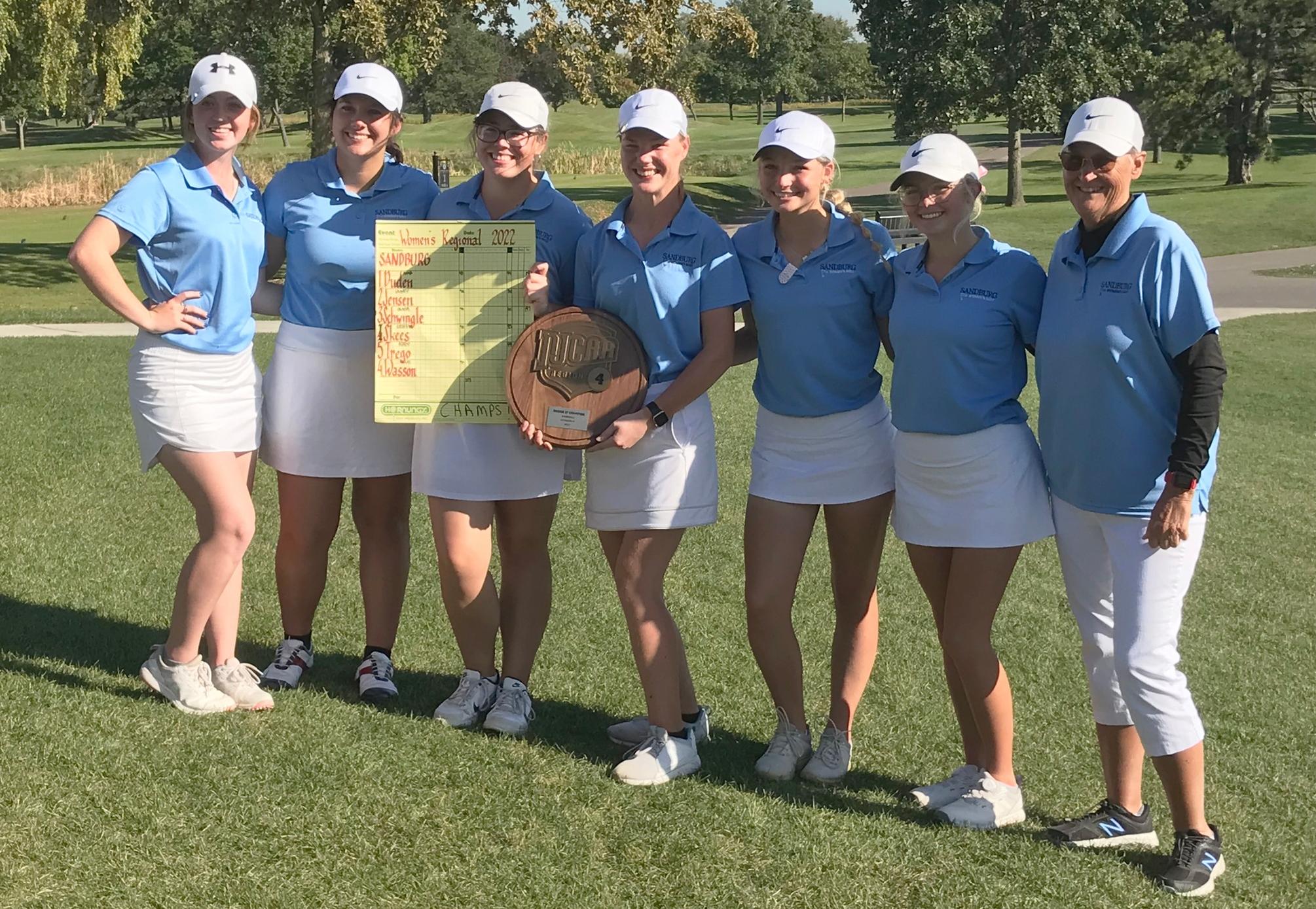 The Carl Sandburg College women's golf team holds the Region IV championship plaque after winning the 2022 Region IV tournament at Heritage Oaks.